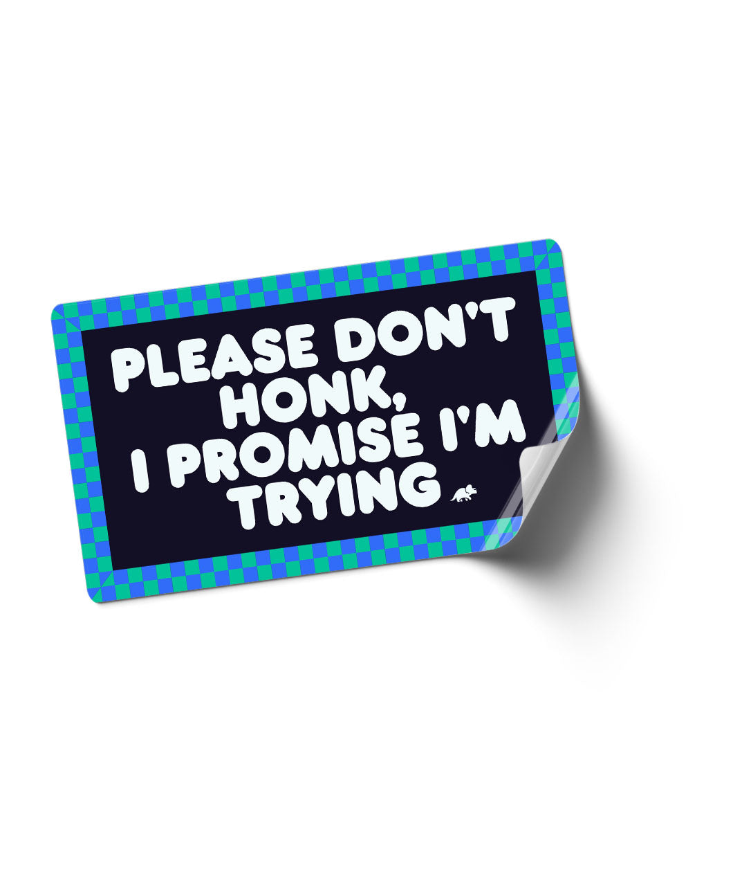 A bumper sticker with a blue and green checkerboard boarder, with text in the middle that reads "Please don't honk, I promise I'm trying". From the Try Guys.