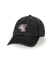 A black stone wash hat with a design of Eugene's Gay Horse creation from Without Instructions. The design features an embroidered stitch of a sassy unicorn with wings. From Try Guys.