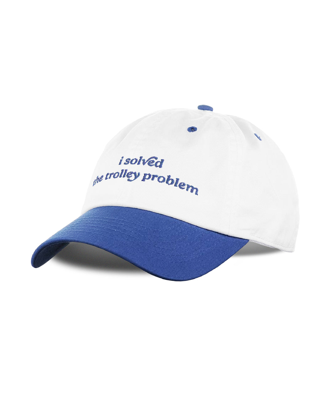 A three-quarters view of a baseball cap that has white panels and a stone washed royal blue bill. On the front of the cap is an embroidered design of script that reads, "I solved the trolley problem." From the Try Guys.