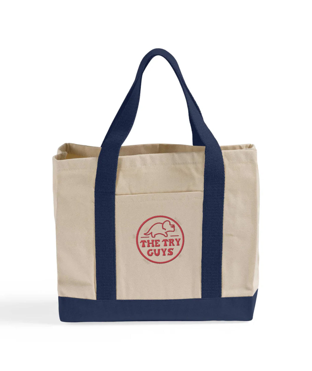 Front view of a canvas bag with navy bottom and handles featuring a front pocket embroidered with a red design of the Tryceratops logo and the text "The Try Guys"